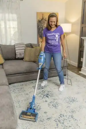 Apartment Cleaner vacuuming carpet