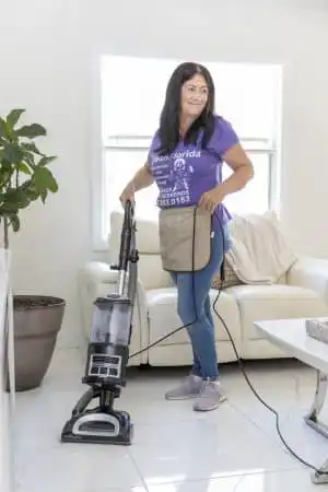 Professional House Cleaner vacuuming