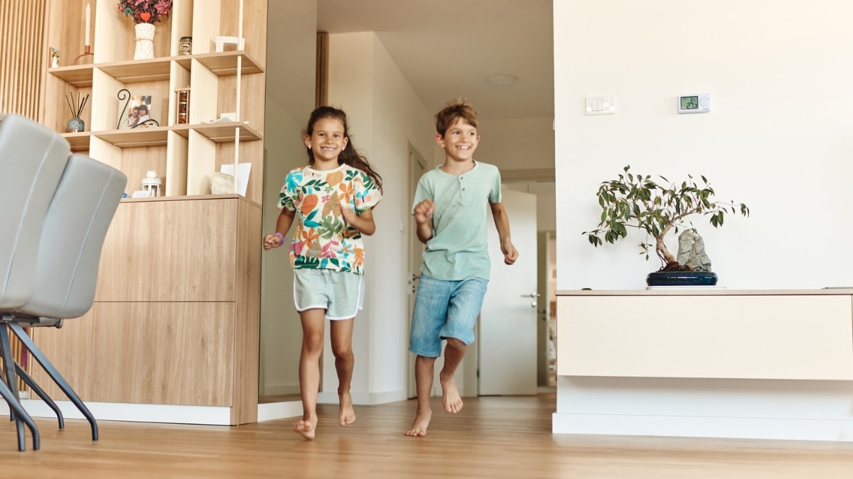 Kids playing safely in a clean family home after detailed maid service.