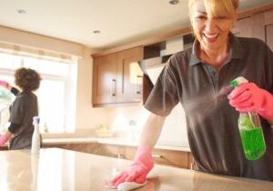 Residential cleaning professionals improving kitchen cleanliness.